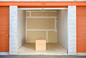 large open storage unit containing one cardboard box