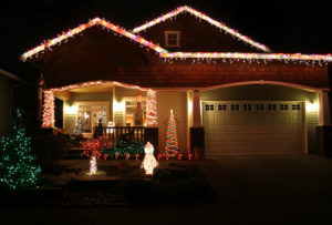 a home lit with Christmas lights